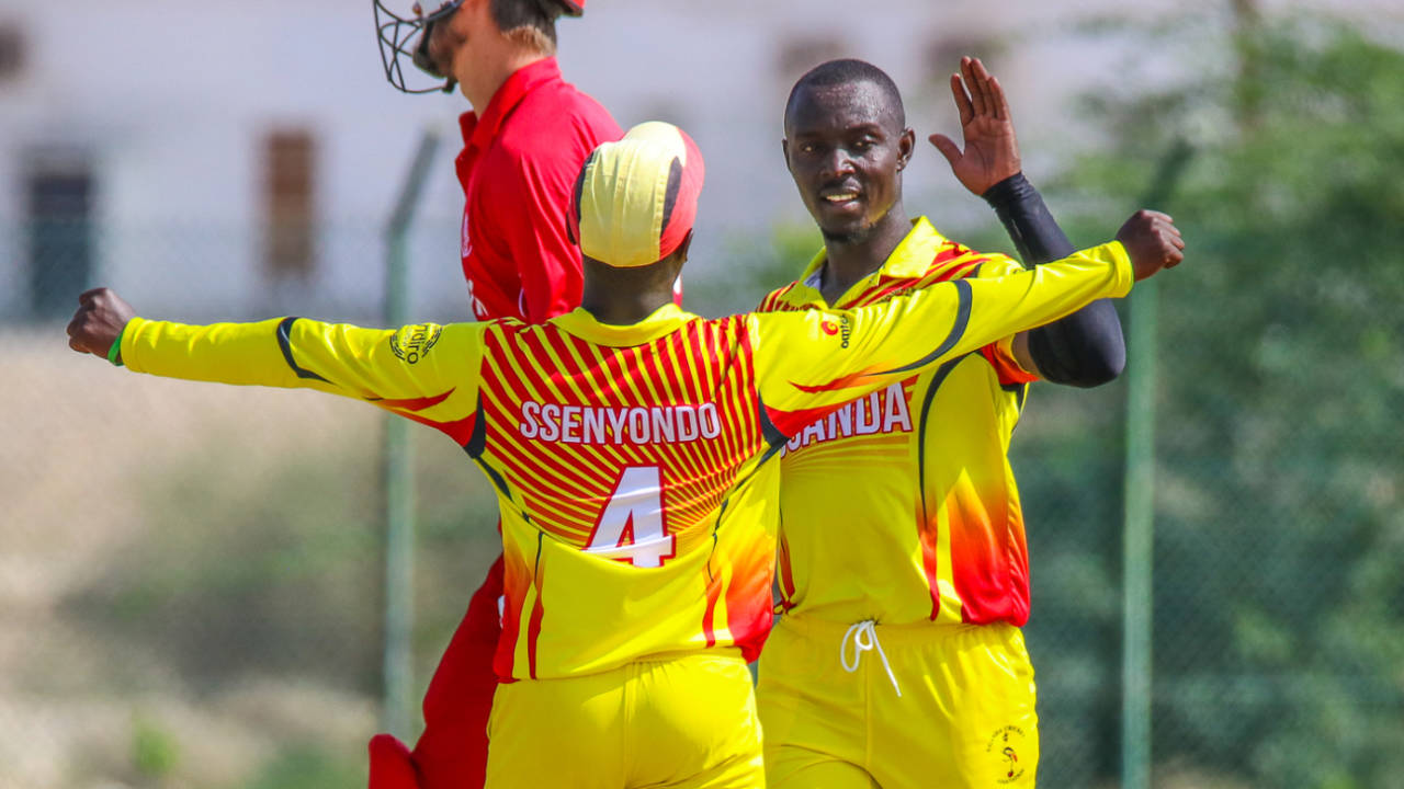 Charles Waiswa gets some love from Henry Ssenyondo after wiping out the tail with 4 for 25, Denmark v Uganda, ICC World Cricket League Division Three, Al Amerat, November 9, 2018