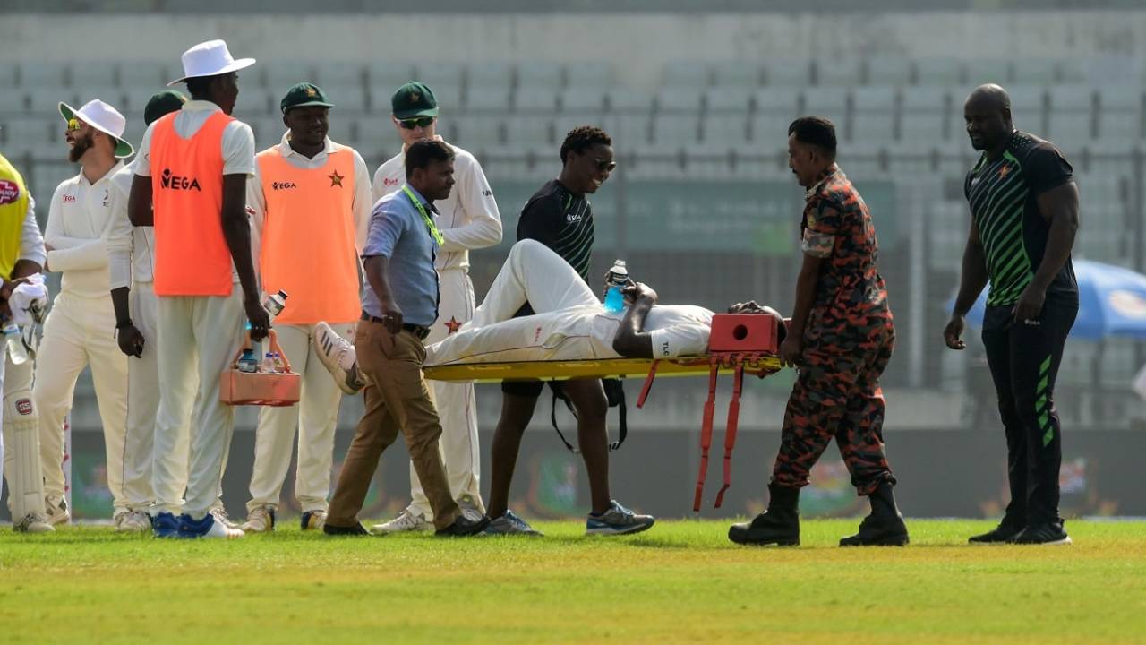 Tendai Chatara is stretchered off after picking up a leg injury, Bangladesh v Zimbabwe, 2nd Test, Mirpur, 2nd day, November 12, 2018