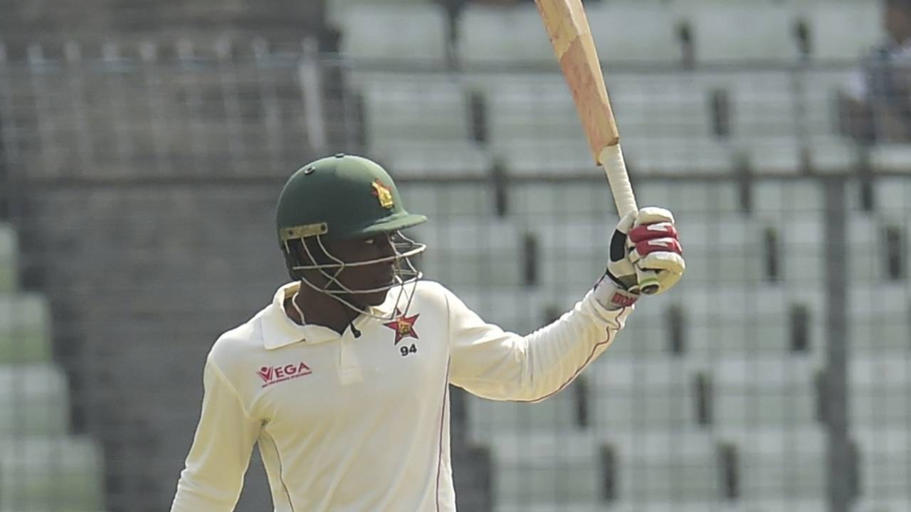 Brian Chari raises his bat after reaching a half-century, Bangladesh v Zimbabwe, 2nd Test, Mirpur, 3rd day, November 13, 2018