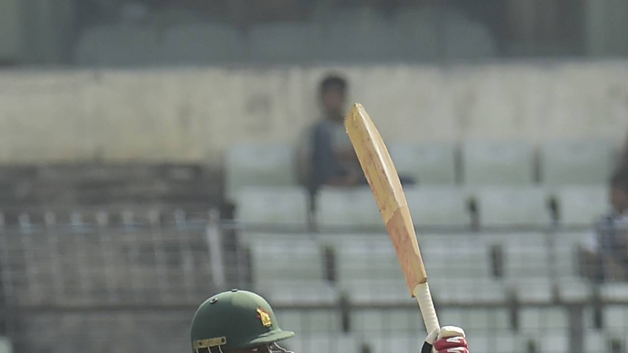 Brian Chari raises his bat after reaching a half-century, Bangladesh v Zimbabwe, 2nd Test, Mirpur, 3rd day, November 13, 2018