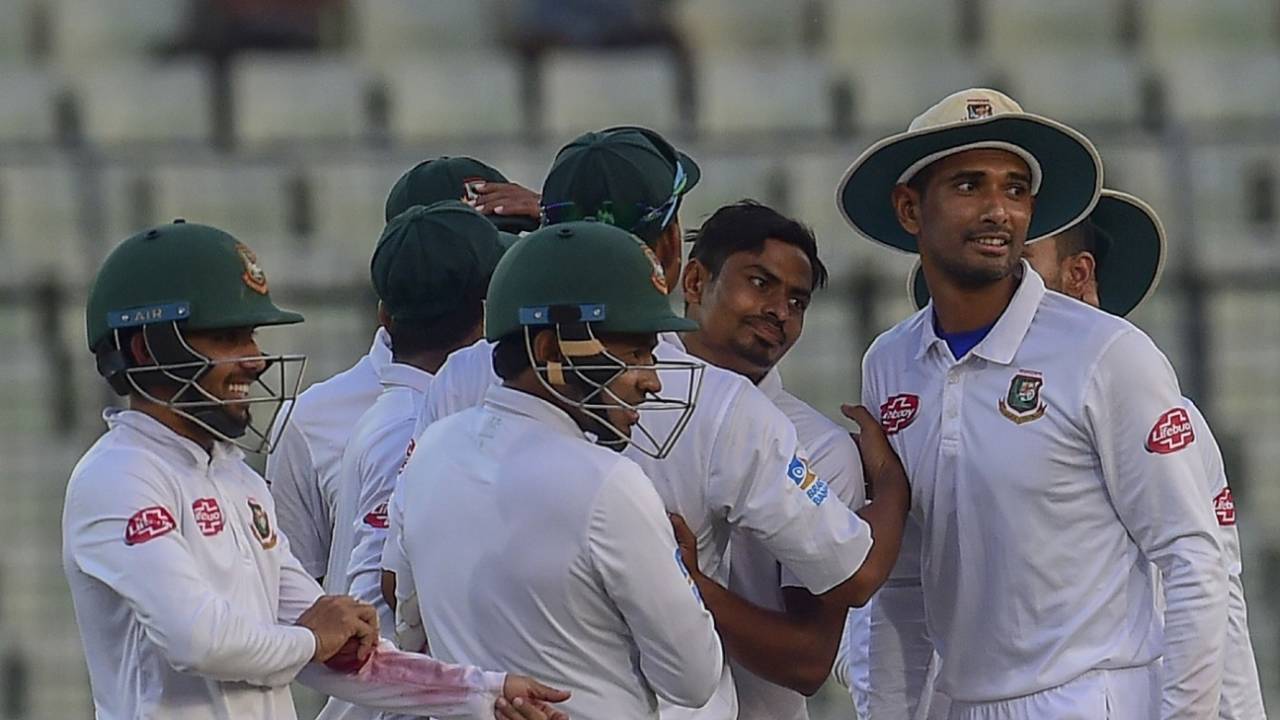 Taijul Islam mobbed by his teammates after completing a five-for, Bangladesh v Zimbabwe, 2nd Test, Dhaka, 3rd day, November 13, 2018