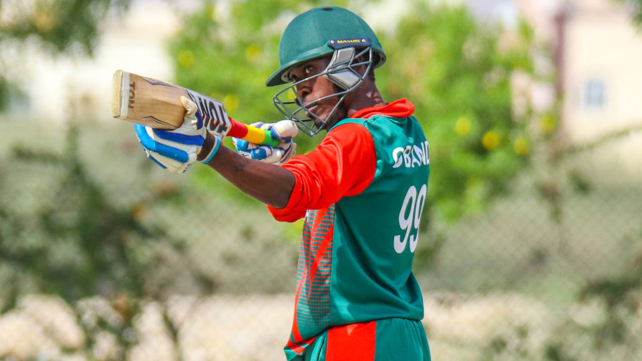 Alex Obanda turns his bat into a mock sniper rifle to celebrate a half-century, Denmark v Kenya, ICC World Cricket League Division Three, Al Amerat, November 18, 2018