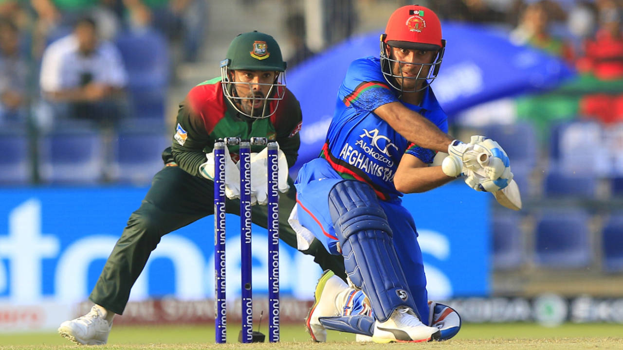 Hashmatullah Shahidi plays a shot as Bangladesh's wicket keeper Liton Das looks on, Afghanistan v Bangladesh - Asia Cup 2018, 	September 20, 2018