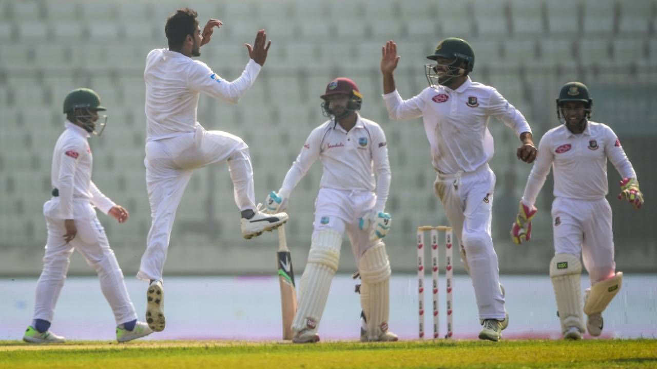 Mehidy Hasan celebrates a wicket with team-mates&nbsp;&nbsp;&bull;&nbsp;&nbsp;AFP