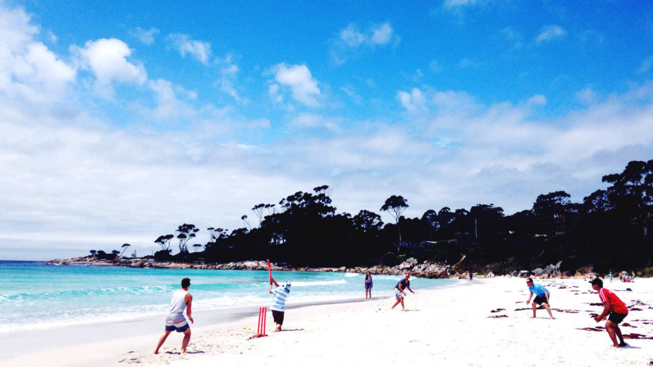 People enjoy a game of beach cricket in Australia, December 26, 2016