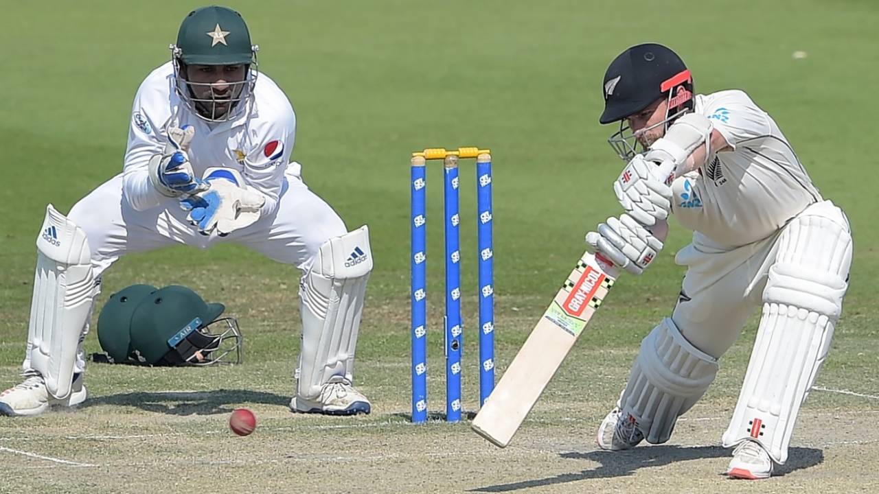 Kane Williamson forces a ball through the off side as Sarfraz Ahmed looks on, Pakistan v New Zealand, 3rd Test, Abu Dhabi, 4th day, December 6, 2018