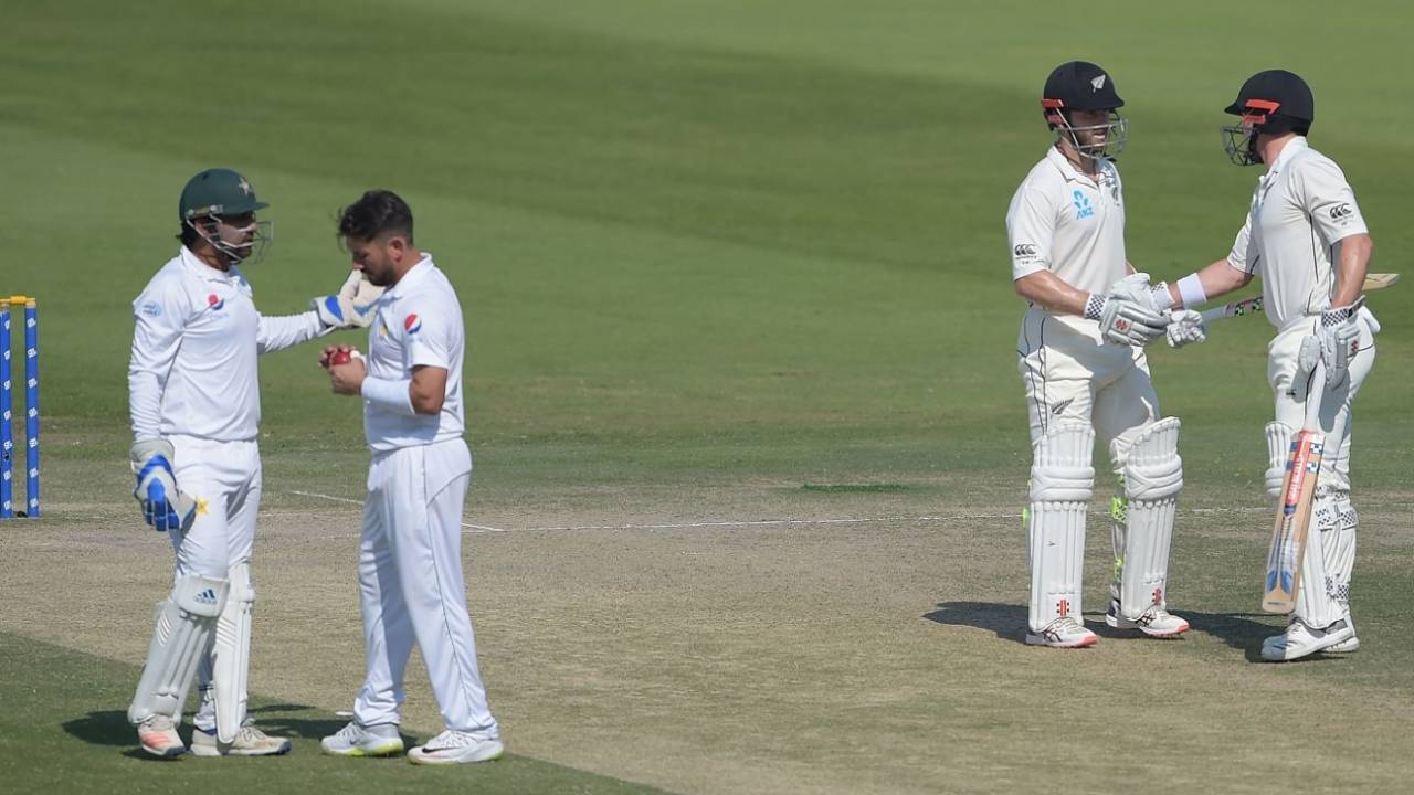 Kane Williamson is congratulated by Henry Nicholls on reaching fifty, Pakistan v New Zealand, 3rd Test, Abu Dhabi, 4th day, December 6, 2018