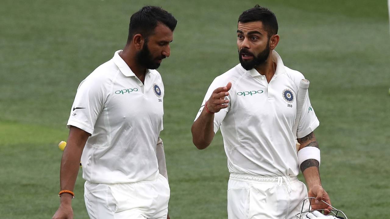 An animated Virat Kohli speaks to Cheteshwar Pujara as they walk off for tea, Australia v India, 1st Test, Adelaide, 3rd day, December 8, 2018
