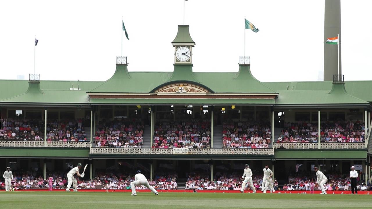 The SCG's members stand in the background as Travis Head plays a shot, Australia v India, 4th Test, Sydney, 3rd day, January 5, 2019