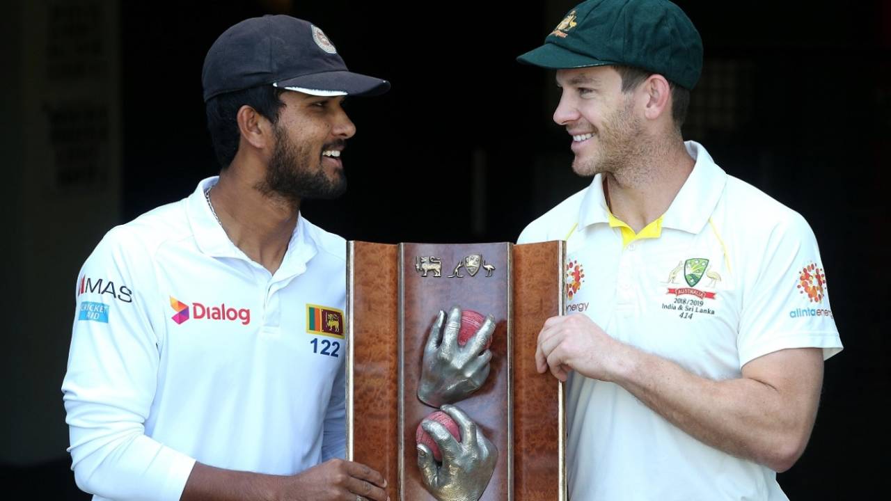 Dinesh Chandimal and Tim Paine pose with the Warne-Muralitharan Trophy, Brisbane, January 23, 2019