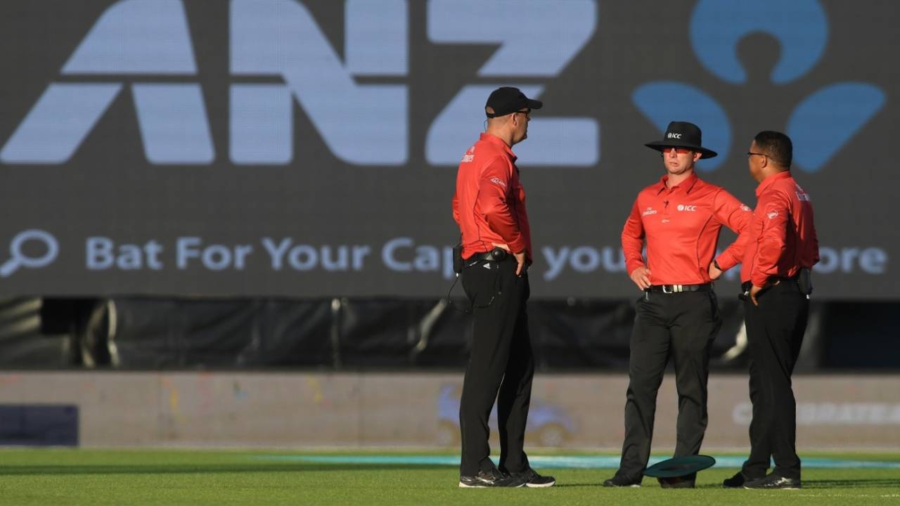 Match officials wait for the sun to move in Napier&nbsp;&nbsp;&bull;&nbsp;&nbsp;Getty Images