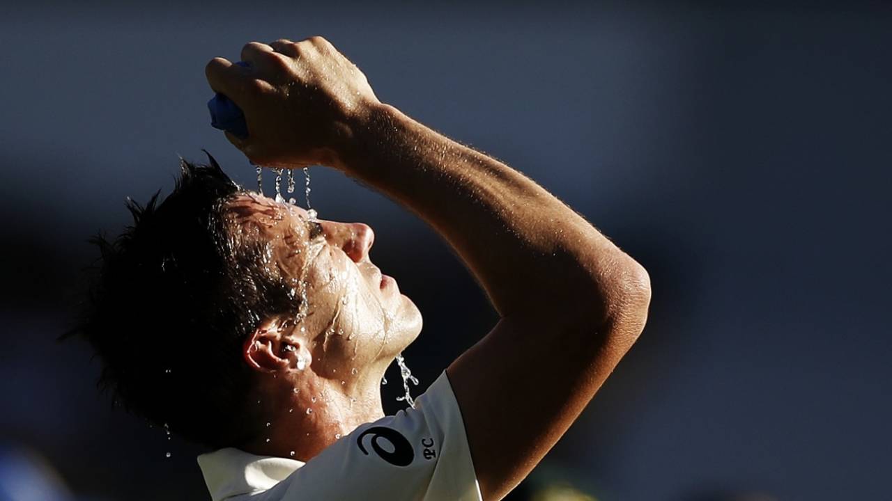 Pat Cummins cools down during a hot afternoon session&nbsp;&nbsp;&bull;&nbsp;&nbsp;Getty Images