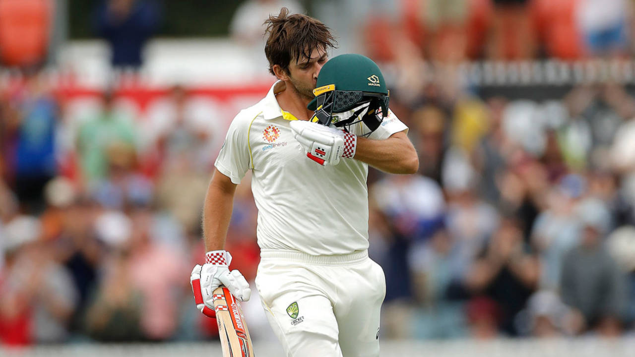 Joe Burns kisses the badge on reaching his century, Australia v Sri Lanka, 2nd Test, Canberra, February 1, 2019