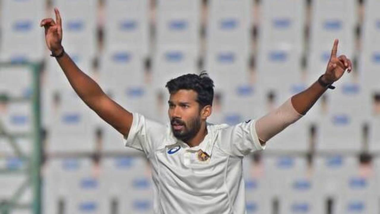 Sandeep Warrier celebrates after taking a wicket