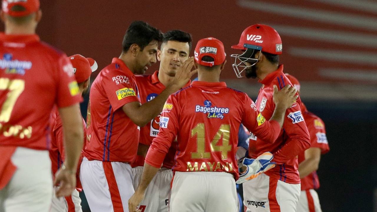 R Ashwin celebrates a wicket with his team-mates