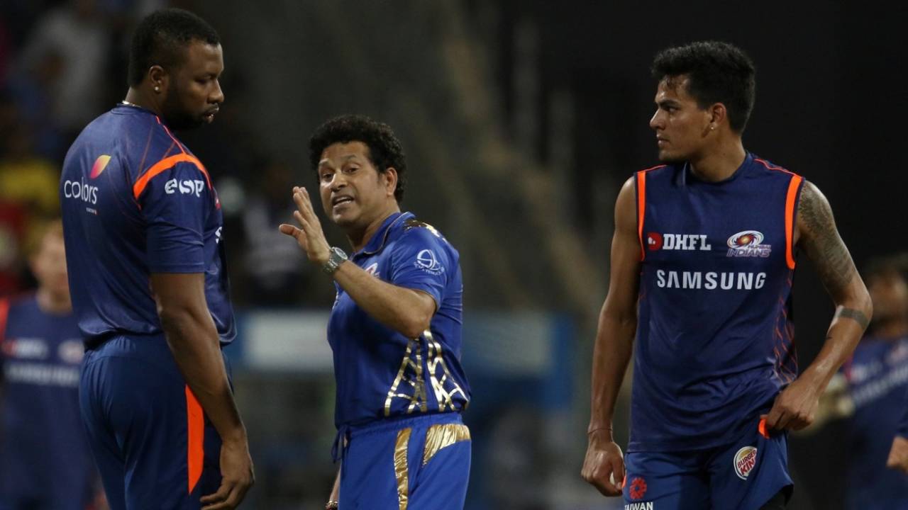 Sachin Tendulkar speaks to Kieron Pollard while Rahul Chahar looks on, Mumbai Indians v Royal Challengers Bangalore, IPL 2019, Mumbai, April 15, 2019