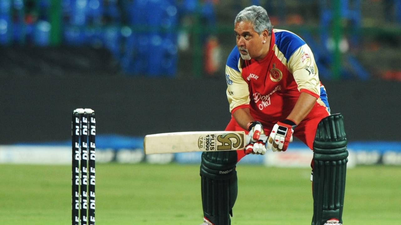 Vijay Mallya attempts a late cut during an exhibition match on the sidelines of IPL 2011