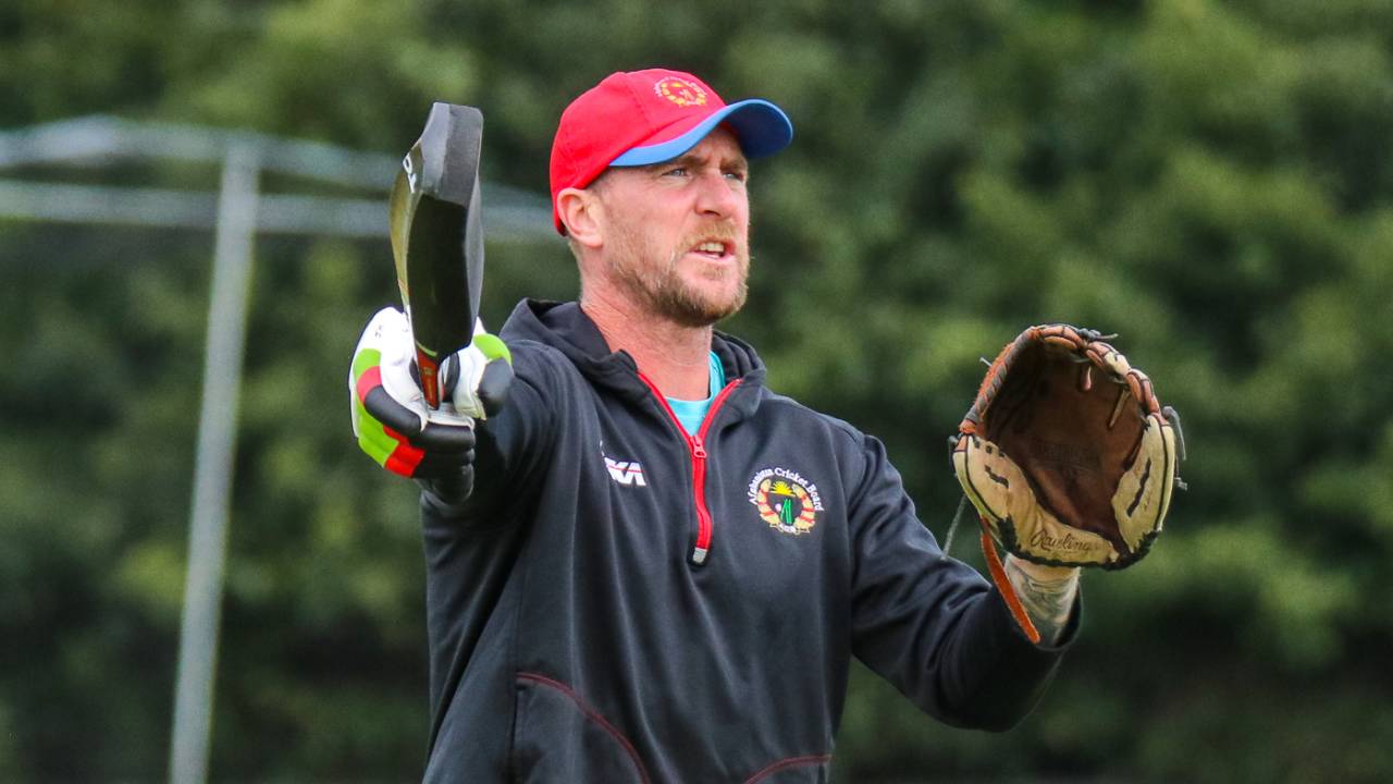 Fielding coach John Mooney directs the squad during an Afghanistan training session