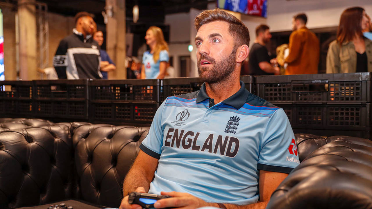 Liam Plunkett plays a video game at the England World Cup kit launch, May 21, 2019