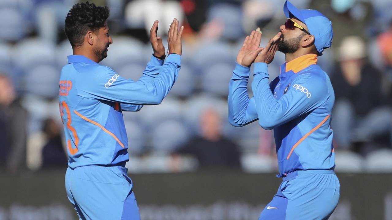 Kuldeep Yadav and Virat Kohli celebrate a wicket, Bangladesh v India, World Cup 2019 warm-up, Cardiff, May 28, 2019