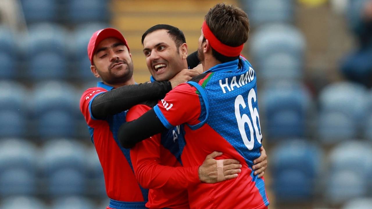 Mohammad Nabi, Rashid Khan and Hamid Hassan celebrate a wicket, Afghanistan v Sri Lanka, World Cup 2019, Cardiff, June 4, 2019