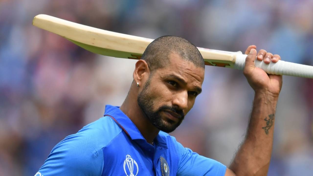 Shikhar Dhawan raises his bat to the crowd as he walks back to the pavilion after his dismissal.&nbsp;&nbsp;&bull;&nbsp;&nbsp;Getty Images