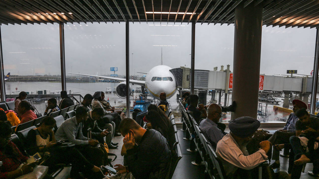 Passengers wait at Amsterdam airport, 2017