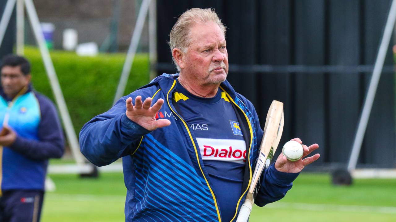 Fielding coach Steve Rixon prepares for a drill during a training session