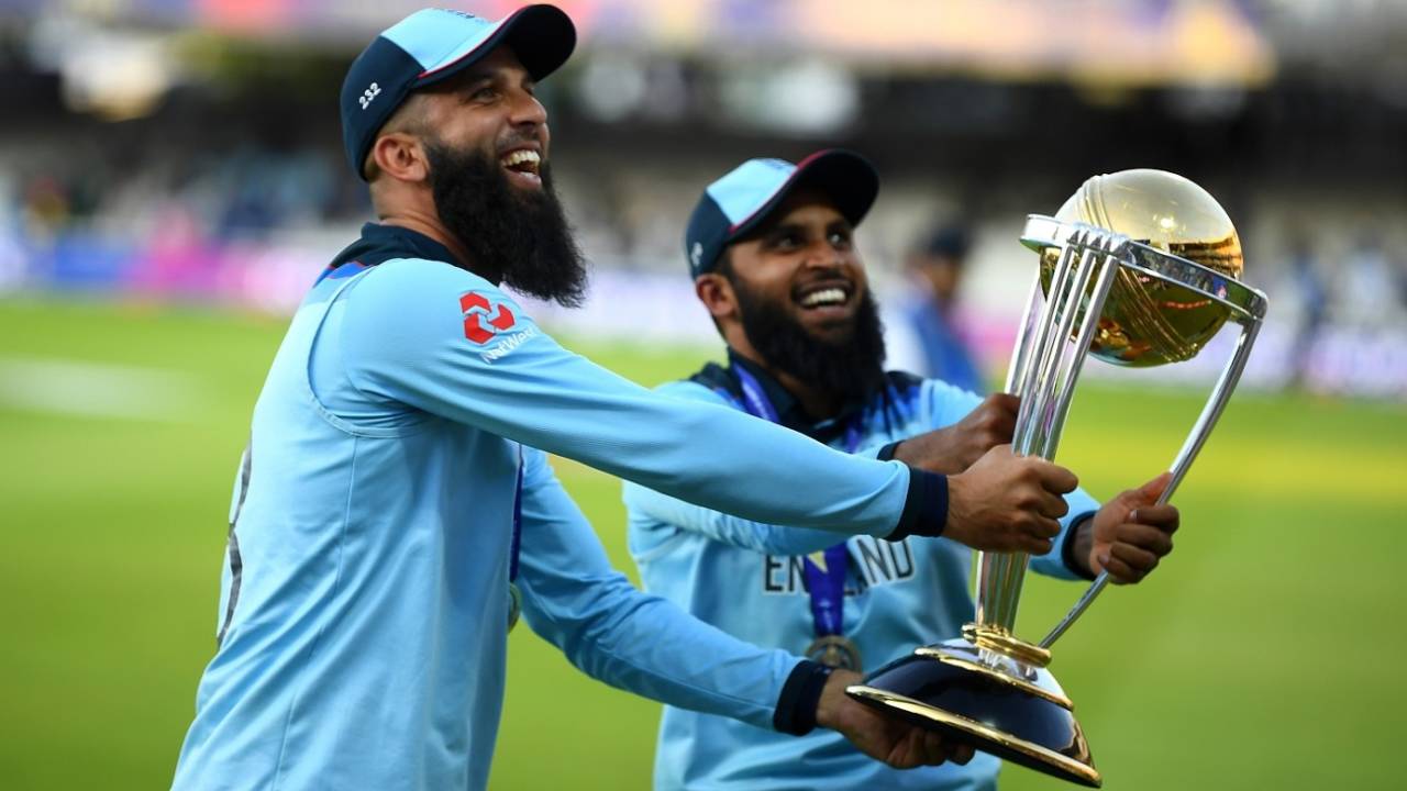 Moeen Ali and Adil Rashid with the trophy, England v New Zealand, World Cup 2019 final, Lord's, July 14, 2019 
