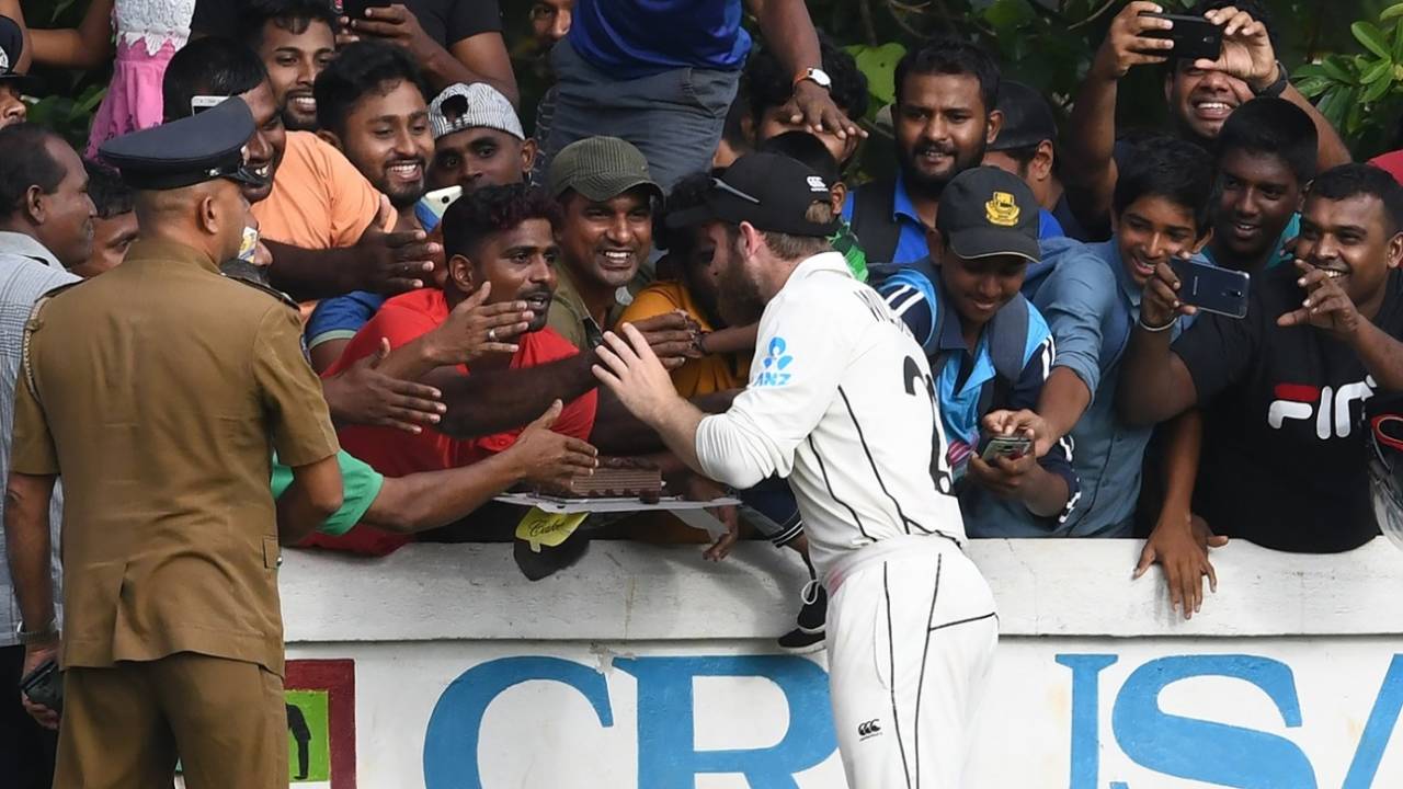 A Sri Lanka fan offers cake to Kane Williamson, Sri Lanka Board President's XI v New Zealand, Katunayake, 1st day, August 8, 2019