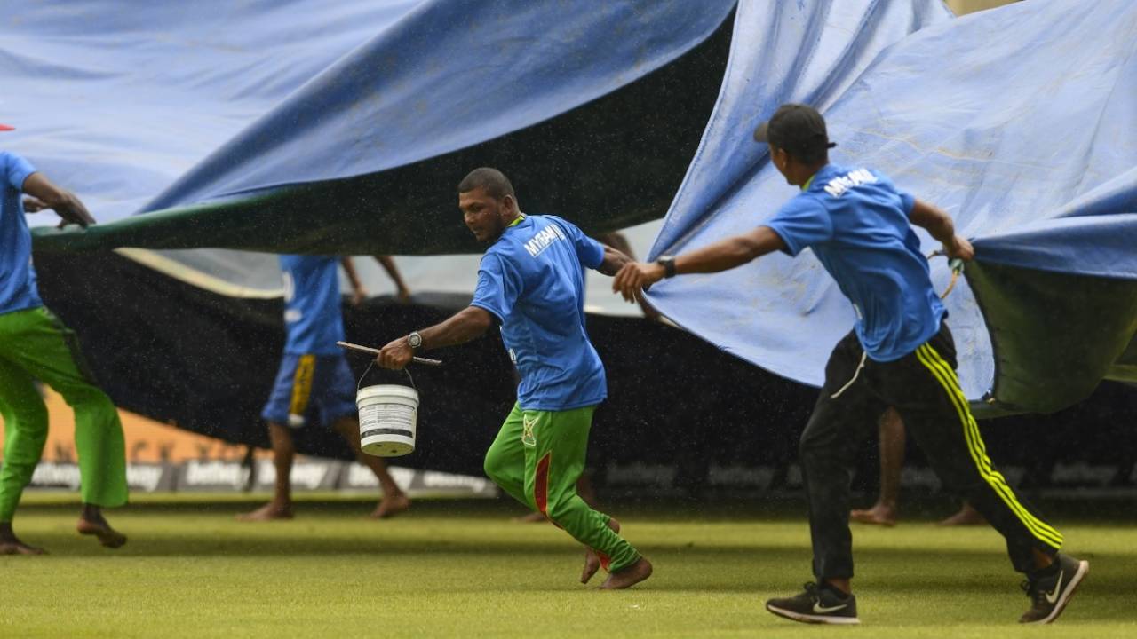 Covers come on almost as soon as the rain - or drizzle - starts in cricket matches&nbsp;&nbsp;&bull;&nbsp;&nbsp;Getty Images