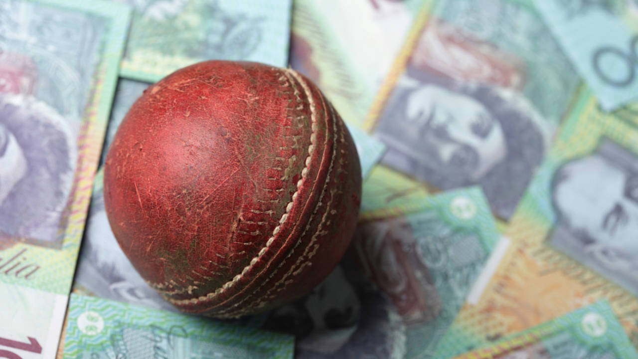 Cricket ball on paper money