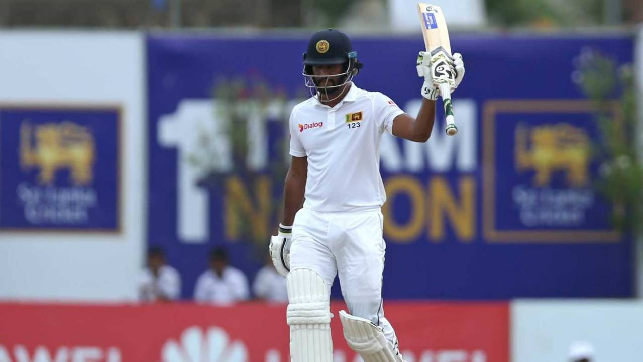 Dimuth Karunaratne raises his bat after bringing up his fifty, Sri Lanka v New Zealand, 1st Test, Galle, 4th day, August 17, 2019