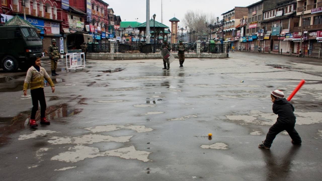 File pic: Children play cricket in Srinagar as Indian paramilitary soldiers patrol the streets&nbsp;&nbsp;&bull;&nbsp;&nbsp;Getty Images