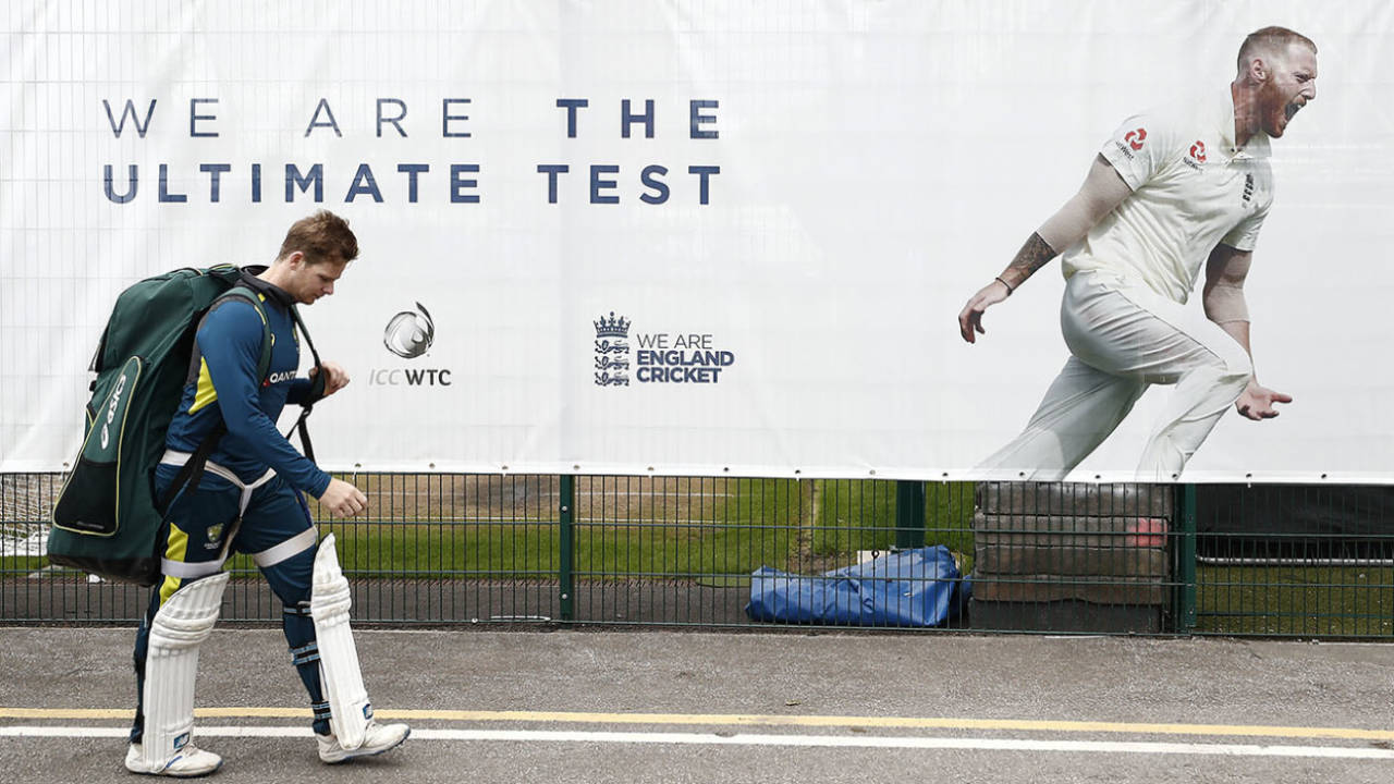 Steve Smith walks back to the changing rooms after a net, ignoring a poster declaring that England represent 'the ultimate test'&nbsp;&nbsp;&bull;&nbsp;&nbsp;Getty Images