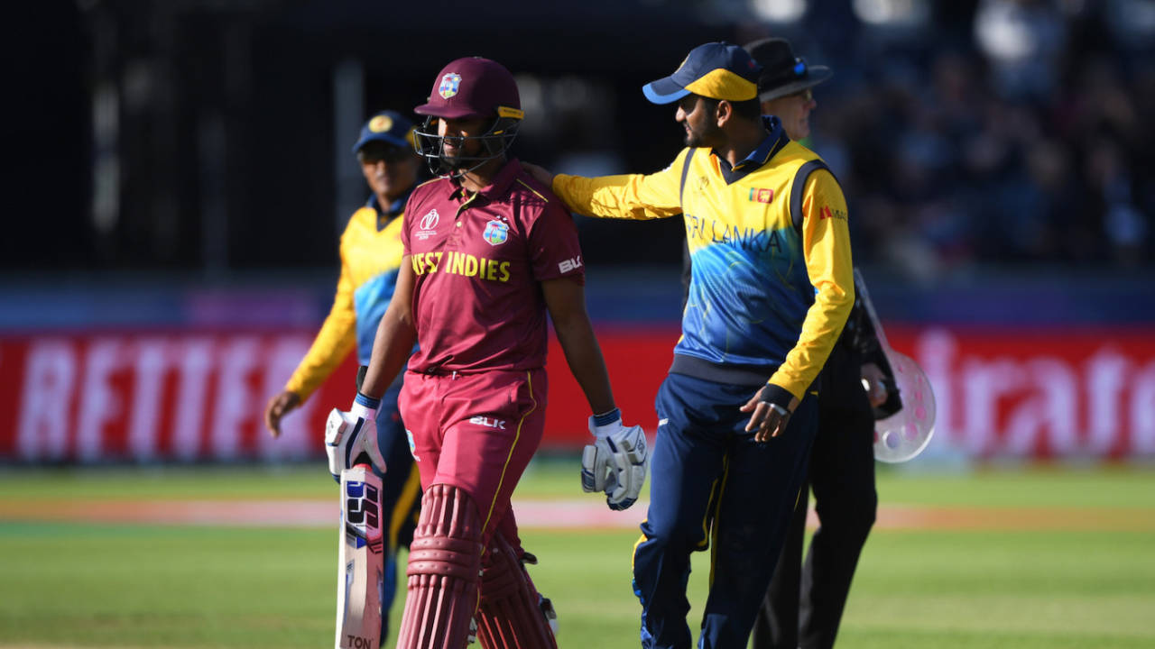 Nicholas Pooran walks off after being dismissed, comforted by Dimuth Karunaratne, World Cup 2019, Sri Lanka v West Indies, Riverside ground, Chester-le-Street, England, July 01, 2019