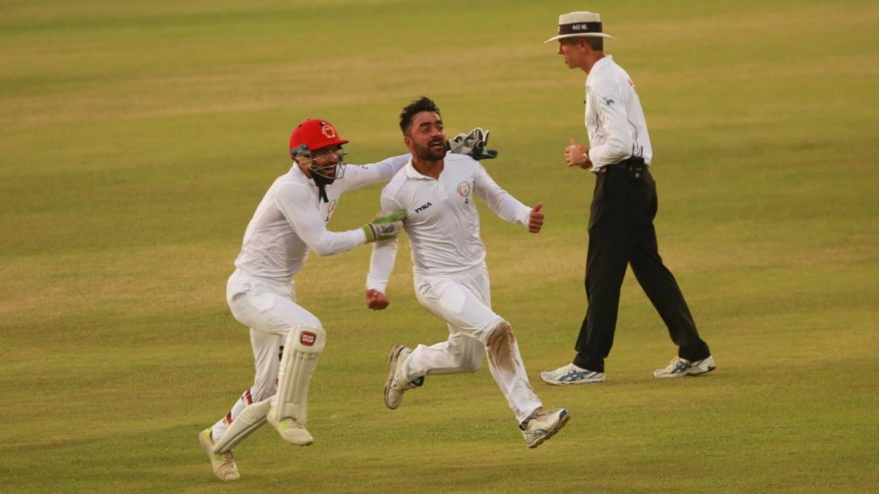 Rashid Khan sets off on a celebratory run, with Afsar Zazai in pursuit, after the last wicket, Bangladesh v Afghanistan, Only Test, Chattogram, 5th day, September 9, 2019