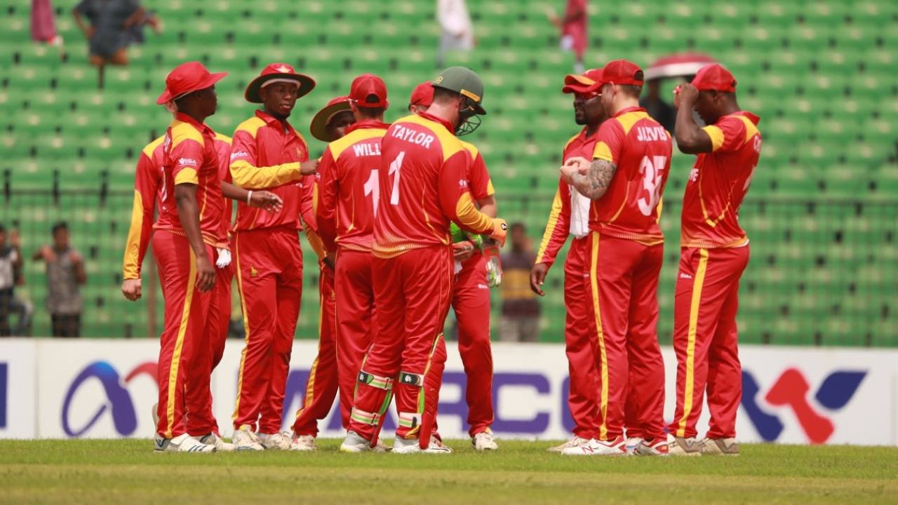 The Zimbabwe players celebrate a wicket in their tour game