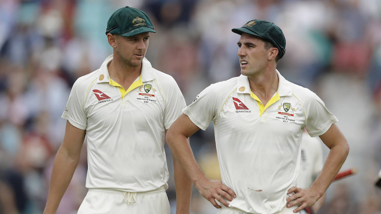 Josh Hazlewood and Pat Cummins of Australia walk from the ground at lunch, day one, 5th Test 2019 Ashes, The Oval, London, England, September 12, 2019
