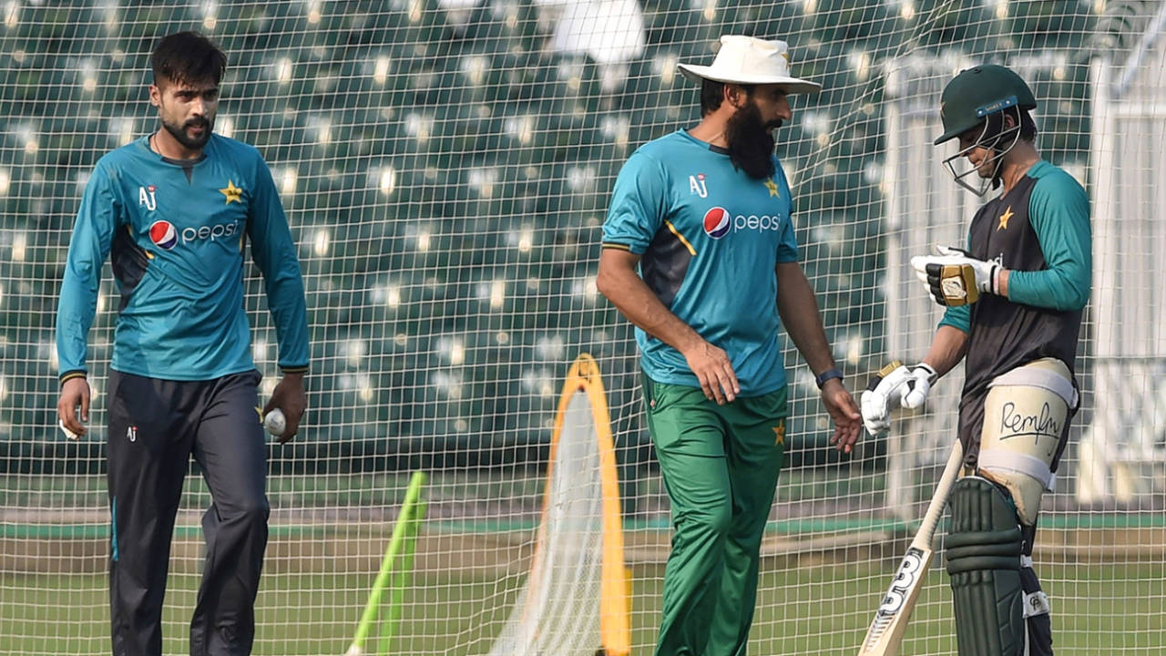 Coach Misbah-ul-Haq chats with Ahmed Shehzad during a training session, Lahore, September 18, 2019