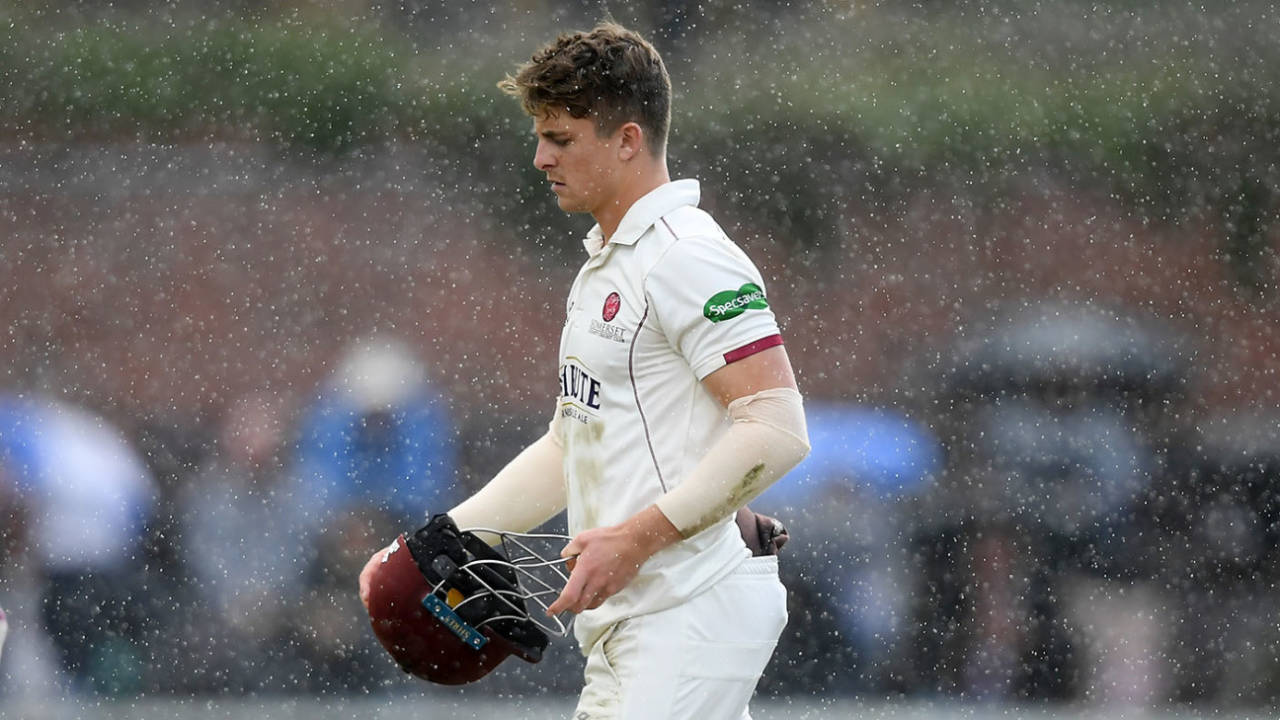 Tom Abell of Somerset walks off as play is delayed due to rain&nbsp;&nbsp;&bull;&nbsp;&nbsp;Getty Images