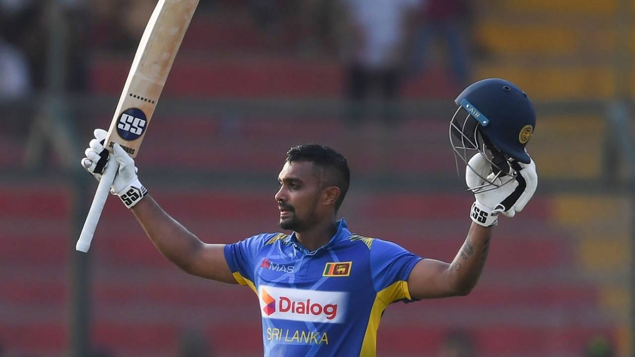 Danushka Gunathilaka raises his bat after getting to hundred&nbsp;&nbsp;&bull;&nbsp;&nbsp;Getty Images