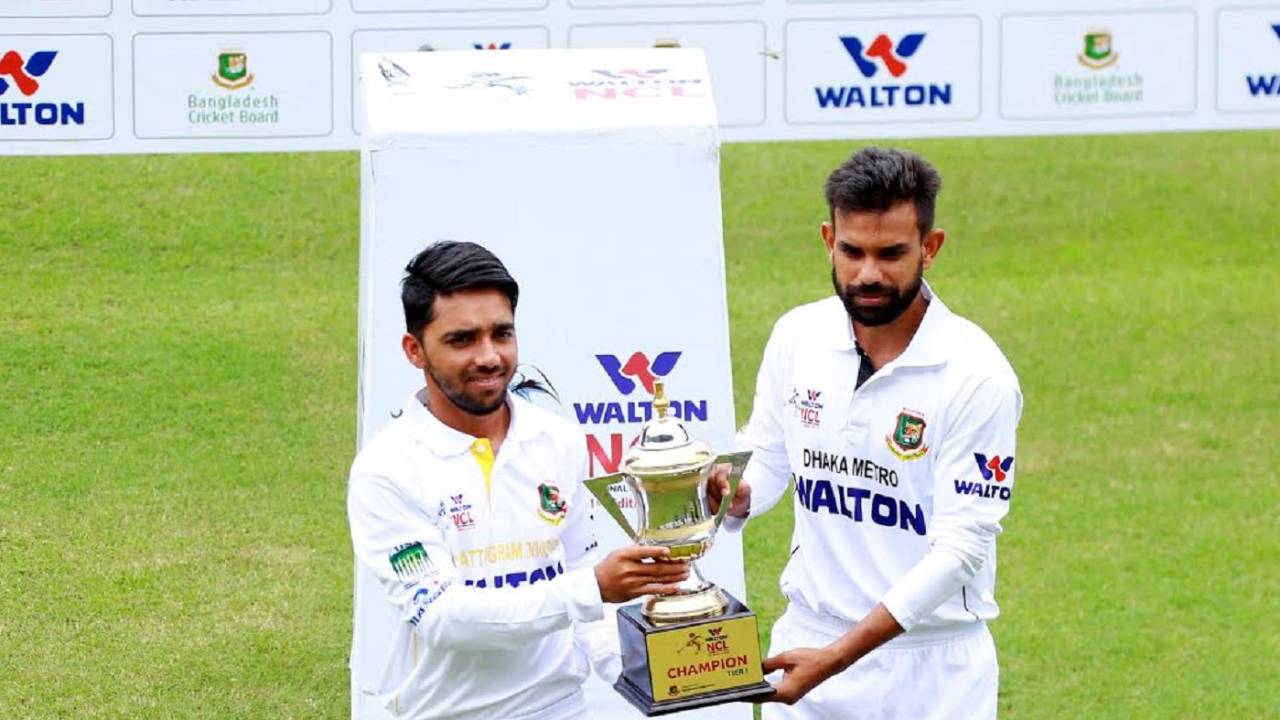 Mominul Haque and Marshall Ayub pose with the NCL trophy