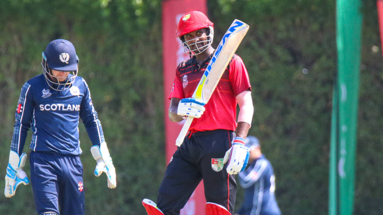 Surendran Chandramohan raises his bat after reaching a half-century, Scotland v Singapore, T20 World Cup Qualifier, Dubai, October 18, 2019