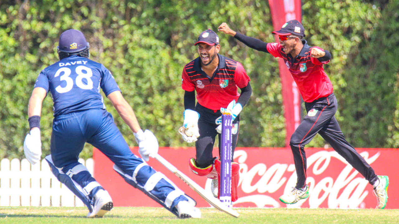 Singapore wicketkeeper Manpreet Singh begins celebrating after Scotland manages just two off the final ball, Scotland v Singapore, T20 World Cup Qualifier, Dubai, October 18, 2019