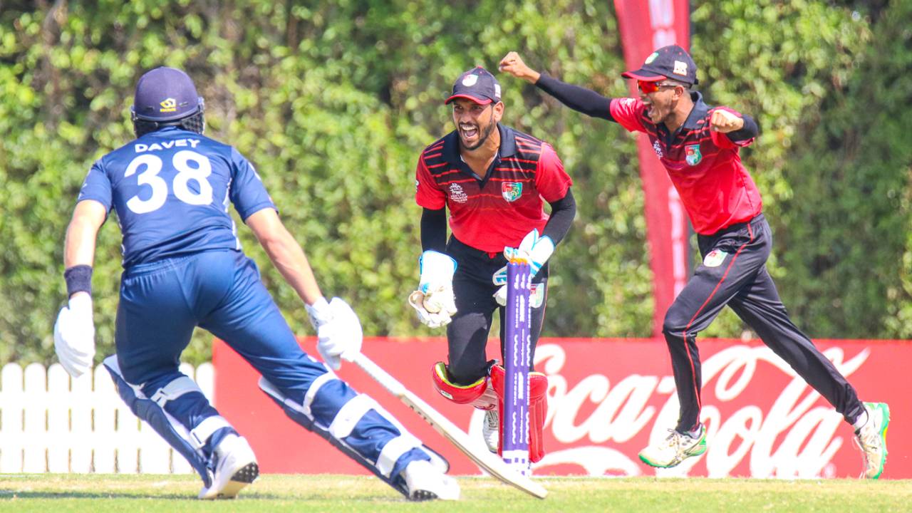 Singapore wicketkeeper Manpreet Singh begins celebrating after Scotland manages just two off the final ball, Scotland v Singapore, T20 World Cup Qualifier, Dubai, October 18, 2019
