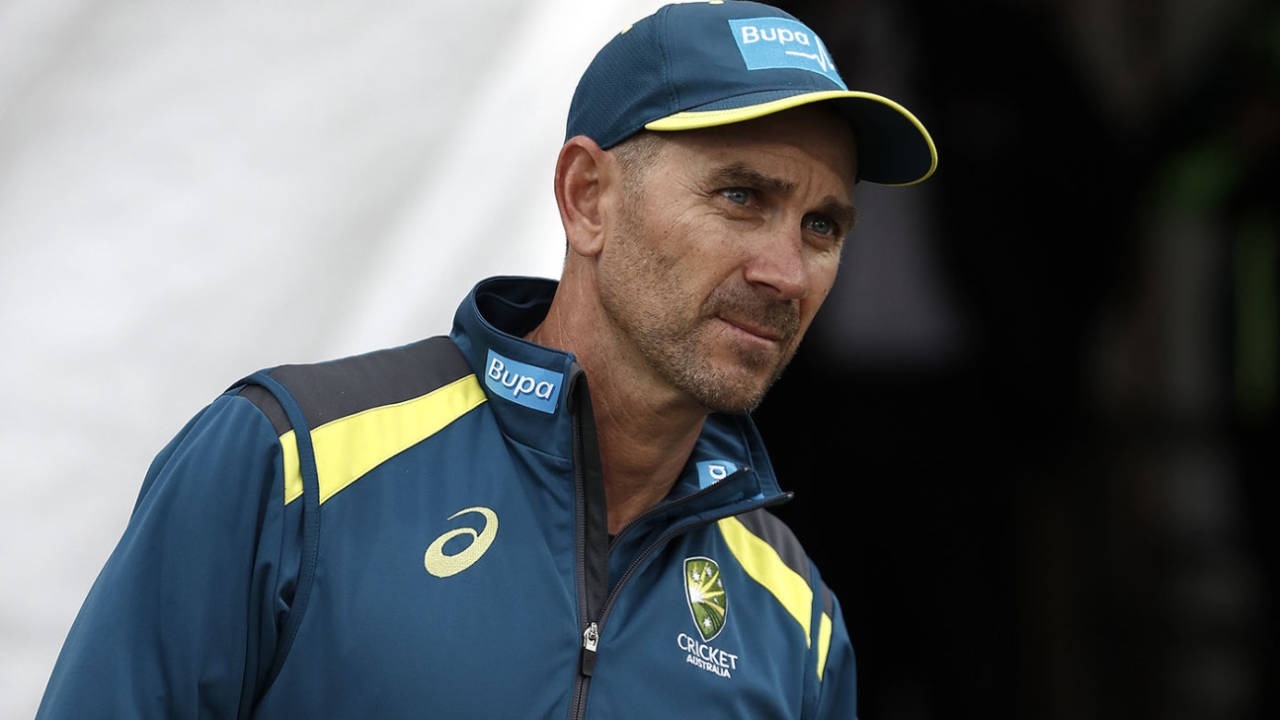 Justin Langer drinks from a mug emblazoned with the message 'One day at a time'&nbsp;&nbsp;&bull;&nbsp;&nbsp;Getty Images