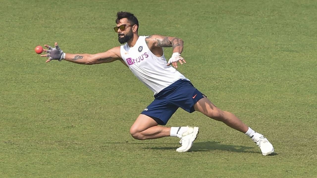 Virat Kohli gets a feel of the pink ball during a fielding session, Kolkata, November 21, 2019