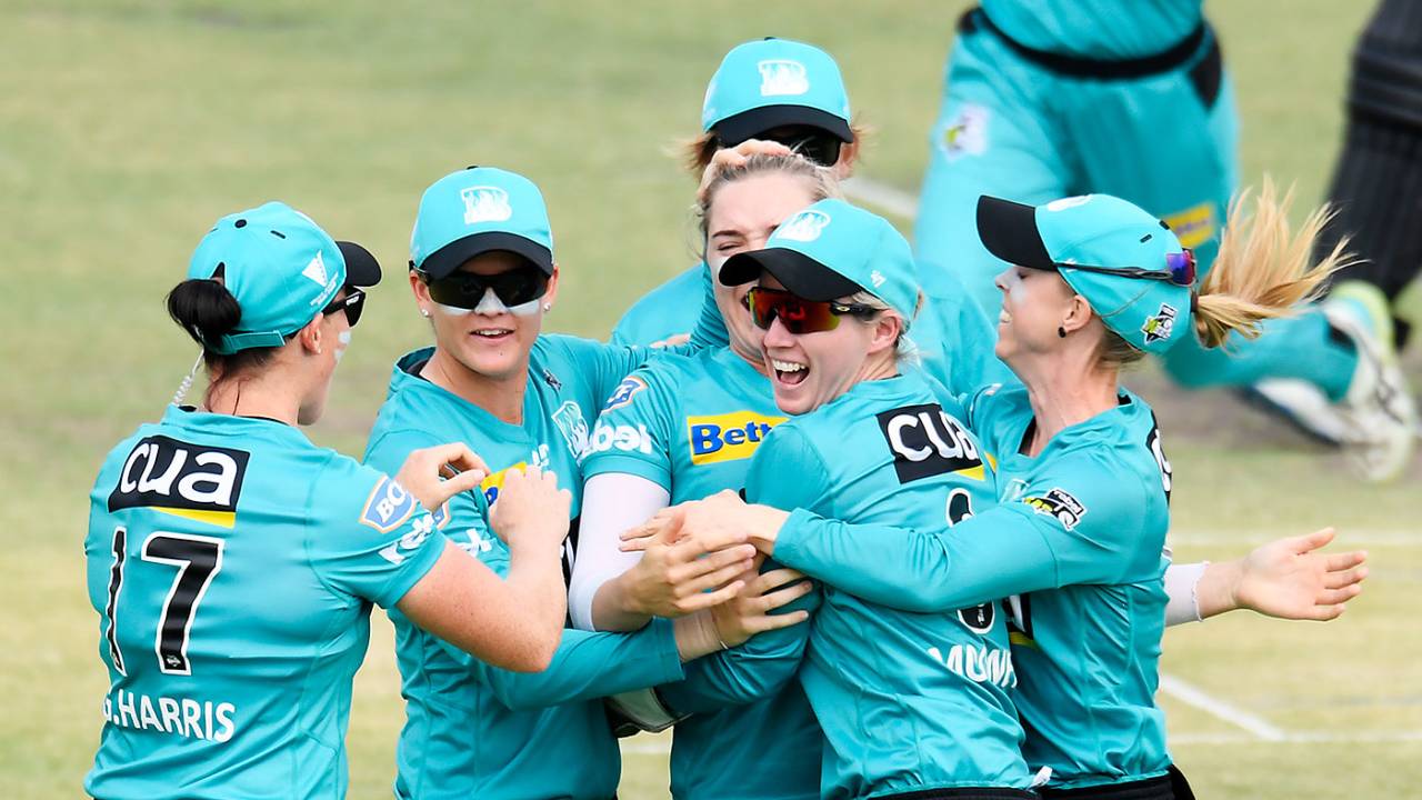 Brisbane Heat celebrate the early wicket of Sophie Devine