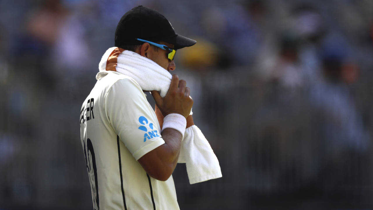 Neil Wagner wears a towel packed with ice while fielding in 40-degree temperatures during the Perth Test